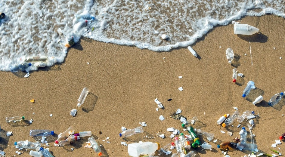 pollution and plastic rubbish on a sandy beach